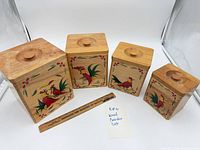 All four wooden canisters displayed in size order with ruler for scale