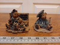 Both Boyds Bearstone figurines with ruler for scale