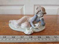 Full view of figurine with ruler for scale