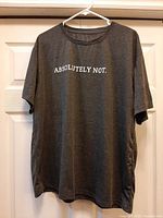 Full view of gray graphic T-shirt on hanger