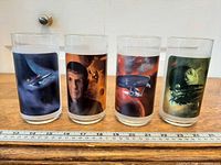 Front view of four Star Trek Burger King glasses with graphics visible