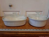 Both casserole dishes side by side showing shape and fluted design