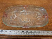 Top view of clear and frosted Mikasa Bountiful Cherries divided tray with ruler for scale