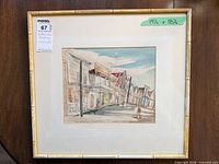 Full view of framed artwork with mat and bamboo-style frame