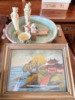 Overview: bowl with contents and framed painting