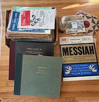 Stack of assorted sheet music and record albums including Gershwin score and Messiah album