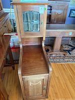 Full view of mission-style bench with cabinet showing overall design and finish