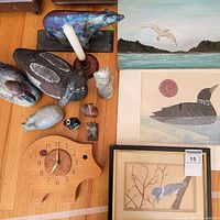 Group shot displaying clock, sculptures, candlestick, framed art