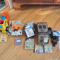 Overview: Walkman, cassette storage boxes, CDs, books, toy