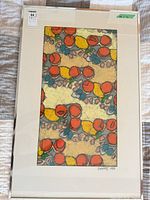 Framed abstract painting showing entire piece with mat and chrome frame