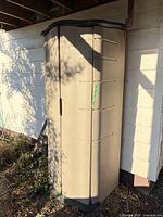 Full front view of closed cabinet against wall