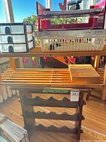 Entire lot showing wine rack, slatted top, plastic drawers, basket and letter trays