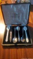 Full set of six small utensils in open presentation box