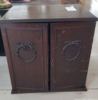 closed dark wood chest showing exterior condition