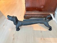 Full side view of cast iron dachshund boot scraper