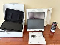 Magnifier device, open packaging with storage case, outer box and user manuals