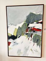 Full view of framed abstract painting on wall