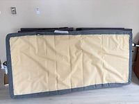 Rear view of adjustable bed base with beige underside panel