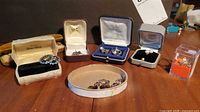 Overview of assorted jewelry in boxes on table