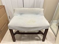 front view of bench showing upholstery and frame