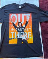 Front view of Paul McCartney Out There Tour T-shirt laid flat