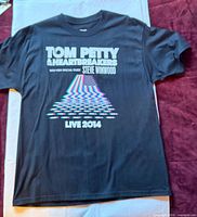 Front view of T-shirt showing main graphics and overall condition