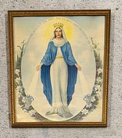 Front view of framed Virgin Mary print showing artwork, frame, and inscription