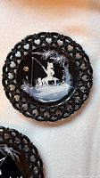 Front of lace plate showing painted boy fishing scene