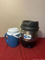 Both jugs side by side showing relative sizes and exterior condition