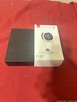 Front view showing boxed Yi camera and black camera unit