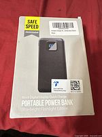 Front of retail box showing Safe Speed portable power bank image and features