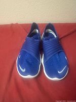 Front view of both shoes showing toe box, color, branding