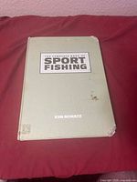 Front cover showing title, author, wear, sticker residue