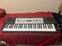 Front view of entire Yamaha YPT-255 keyboard showing 61 keys and speakers