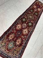 Full view of red Hamedan runner showing entire length and pattern