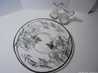 large silver overlay plate with oil and vinegar cruets