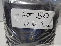 Labelled bag of LEGO bricks showing lot number and weight