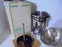 Farberware box, urn body, lid and brew basket parts displayed