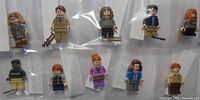 All ten bagged Lego minifigures in two rows