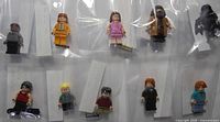 All ten minifigures in protective bags