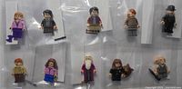 Group shot of all ten minifigures in bags