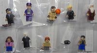 Ten individually bagged minifigures laid out for overview
