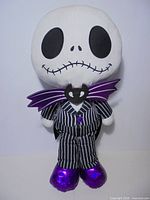 Front view of full Jack Skellington plush showing suit and boots