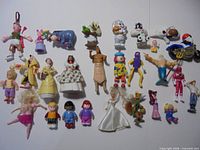 Full lot of 27 assorted character figures spread out for overview