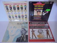 Group shot of four sealed LPs