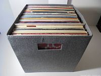 Grey fabric cube filled with LP records