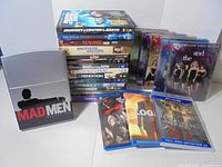 Group shot of stacked and spread DVDs and Blu-Rays