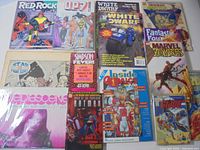 Group shot of 12 assorted comic magazines and trades