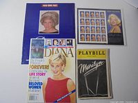 All four items laid out: stamp sheet, Playbill, two Diana magazines