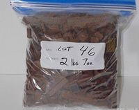 Bagged lot of reddish brown LEGO pieces with handwritten label